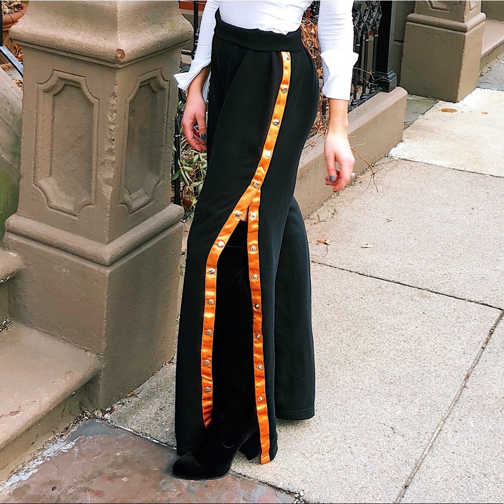 Black sweatpants with orange stripe